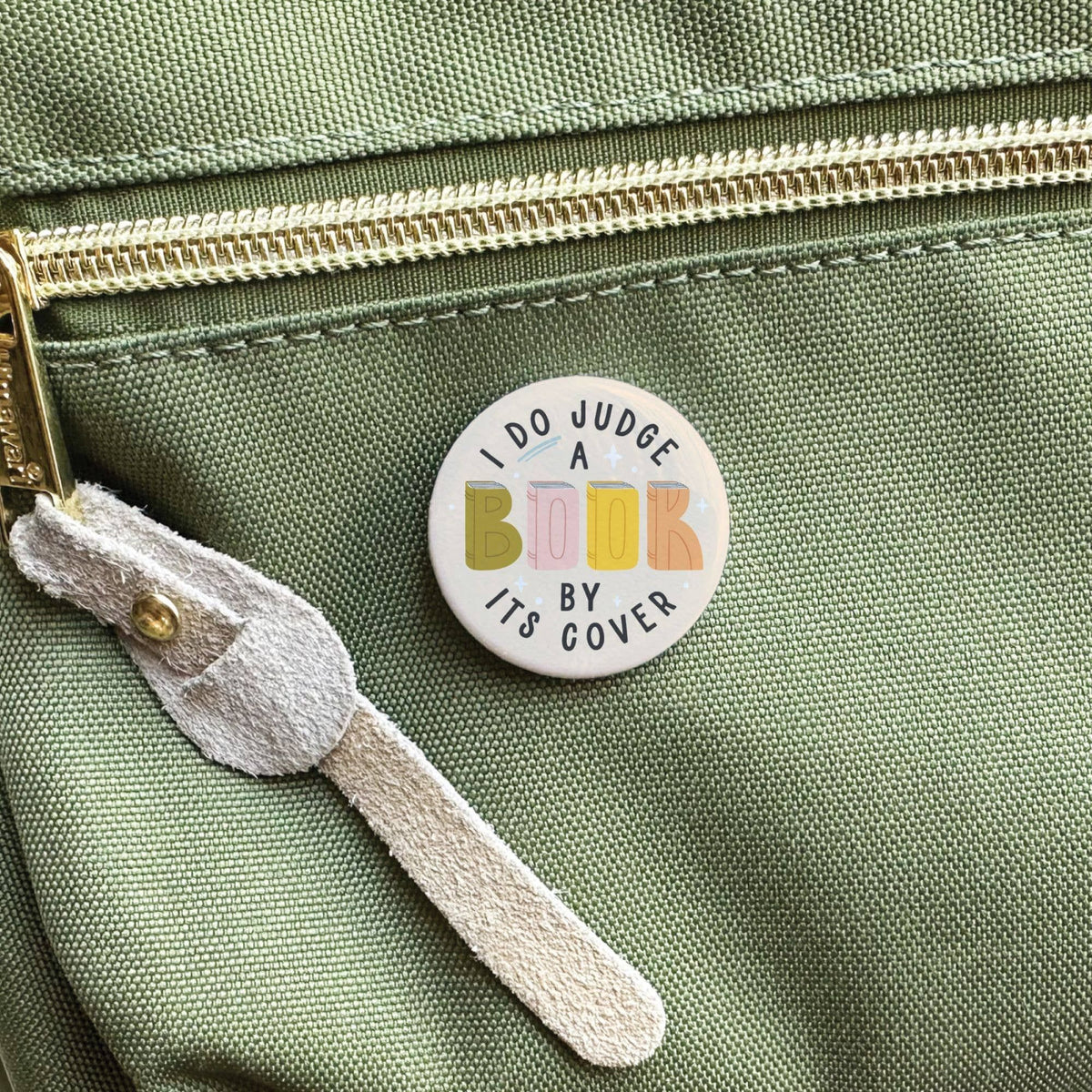 Packaged I DO Judge a Book By Its Cover Pinback Button BookGeek